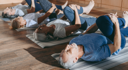 Yoga class for preventing chronic disease in Wind-Relieving Pose (Apanasana)