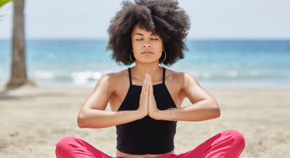 Woman practicing yoga for steadiness in Seated Pose