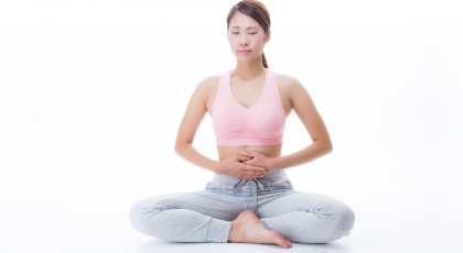 Woman practicing belly breathing yoga