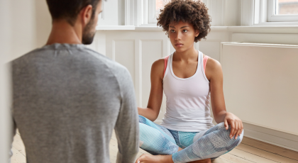 Yoga student and teacher working with chronic pain