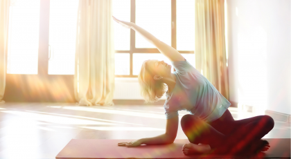 woman practicing yoga for cancer to help alleviate lymphedema