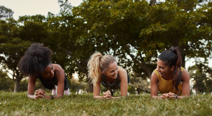 Teens practicing yoga for anxiety in Plank Pose (Phalakasana)