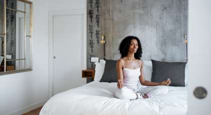 Woman practicing yoga for better sleep in seated pose