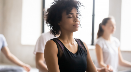 Woman practicing yoga for neck health