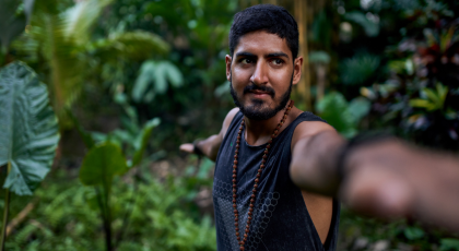 Man practicing yoga Warrior II Pose (Virabhadrasana II)