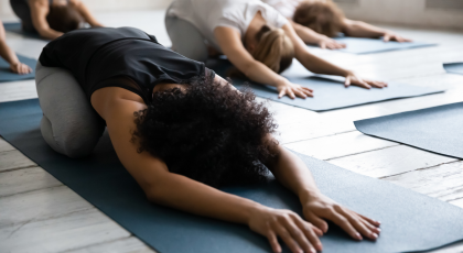 Woman practicing yoga for awareness in Child's Pose (Balasana)