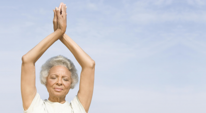 Older beginner yoga yoga student enjoying the benefits of meditation