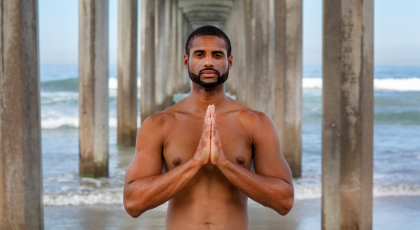Man practicing yoga for sleep and body clock