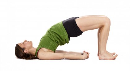 Woman in Bridge Pose (Setu Bandha Sarvangasana) to help have better posture