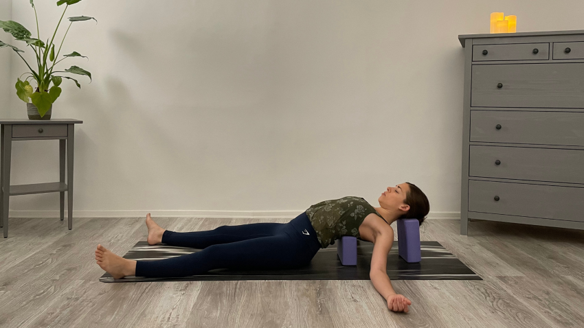 Supported Fish Pose is a restorative backbending pose to support improved posture.