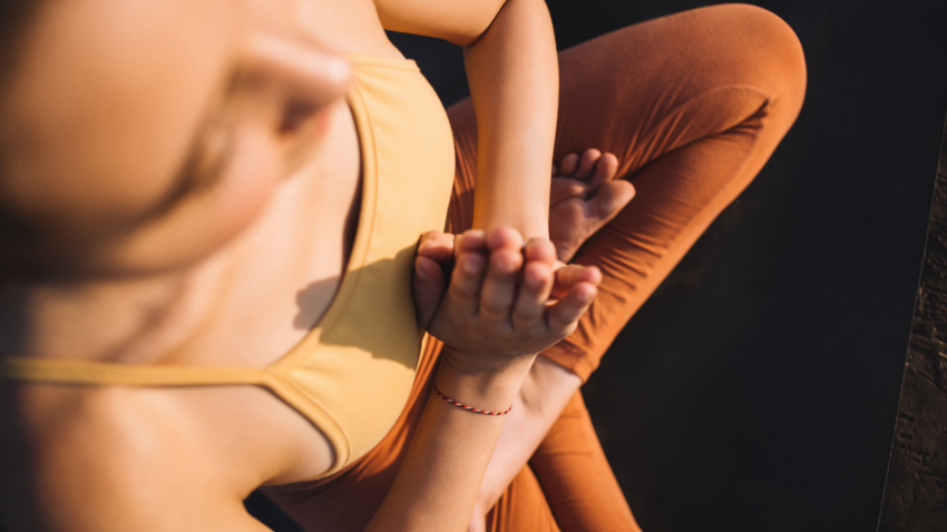 How to commit to the path of yogic wisdom Young woman meditating and tuning into inner yogic wisdom