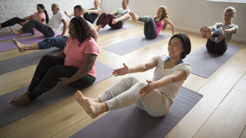 Image depicting a diverse and inclusive yoga class.