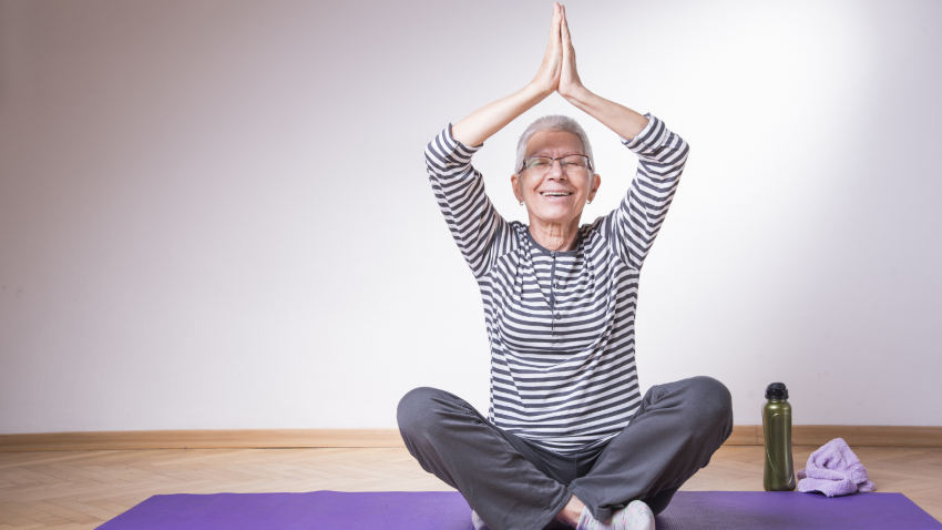 How to practice yoga to help improve the symptoms of tension headaches Yoga student practicing to reduce the symptoms of tension headaches