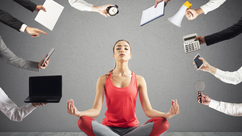 Woman tries to keep calm with yoga position due to stress and overwork at work
