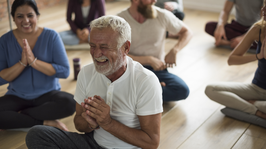 Diversity and people together in yoga class.
