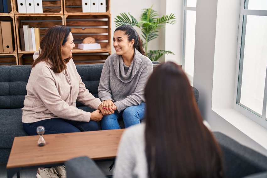 Three woman mother and daughter having psychology therapy at psychology center Three woman mother and daughter having psychology therapy at psychology center