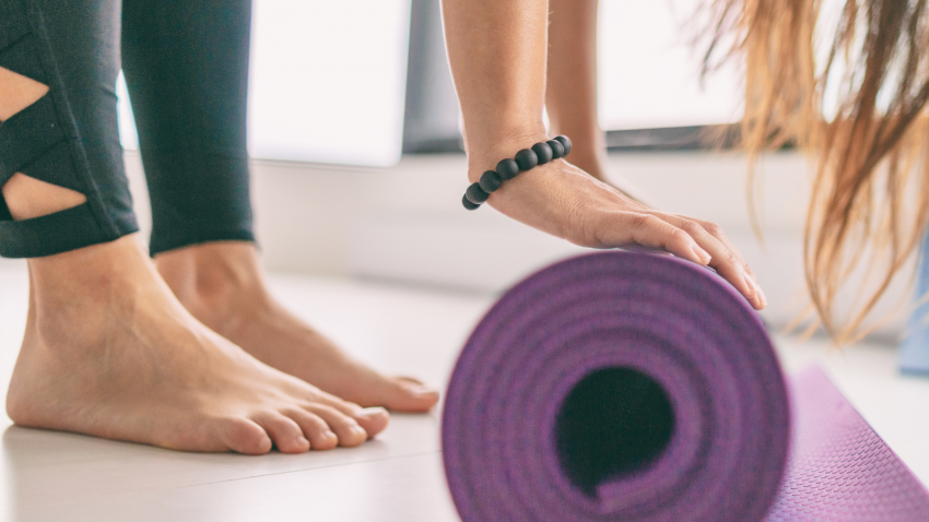 Yoga as a health and wellness activity including yoga for foot health Yoga mat in fitness class for health and wellness including healthy feet