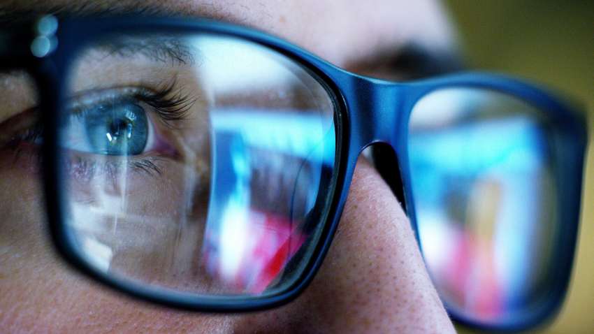 closeup of woman staring at computer screen