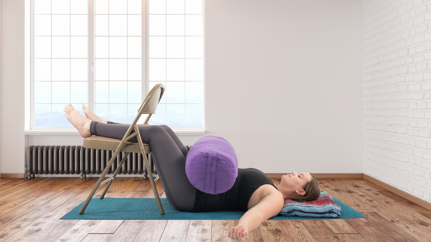 Woman practicing yoga in Constructive Rest Pose for the psoas Woman practicing yoga in Constructive Rest Pose for the psoas