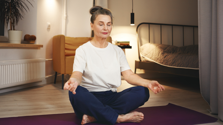Woman practicing yoga meditating Woman practicing yoga meditating