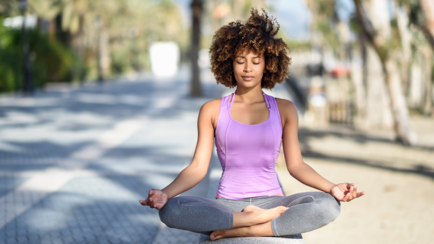 Woman practicing yoga meditation outside. Woman practicing yoga meditation outside.