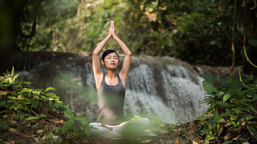 Woman practicing yoga meditation with eyes closed. Woman practicing yoga meditation with eyes closed.