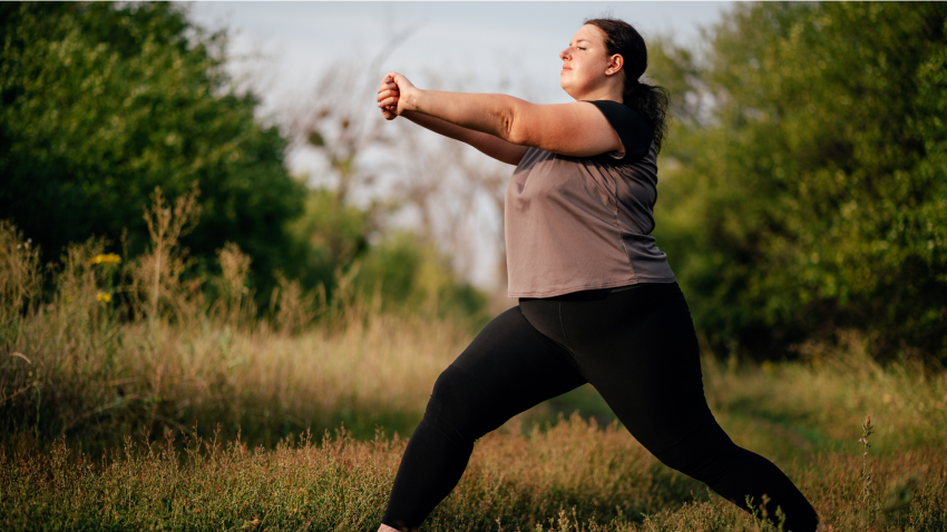 Woman practicing yoga for back pain lunge arm stretch Woman practicing yoga for back pain lunge arm stretch
