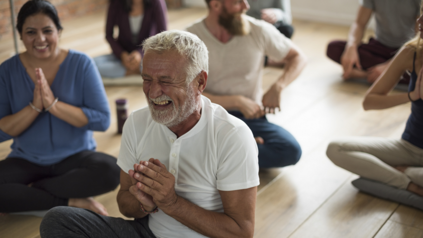 Older man practicing yoga for healthy aging Older man practicing yoga for healthy aging