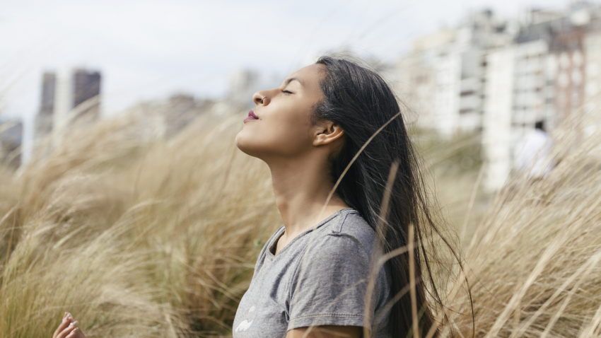 Woman practicing yoga for chronic pain breathing