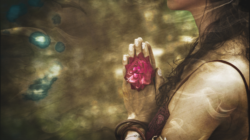 woman standing in prayer, mudra hands, practicing mediation or prayer, energy anatomy woman practicing prayer or meditation, exploring the Chakras, energy anatomy