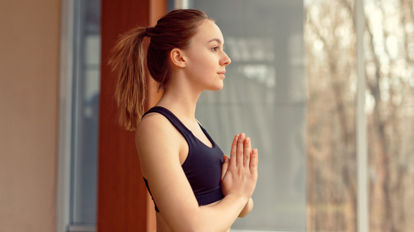 Closeup of woman practicing Tadasana mountain pose. Closeup of woman practicing Tadasana mountain pose.