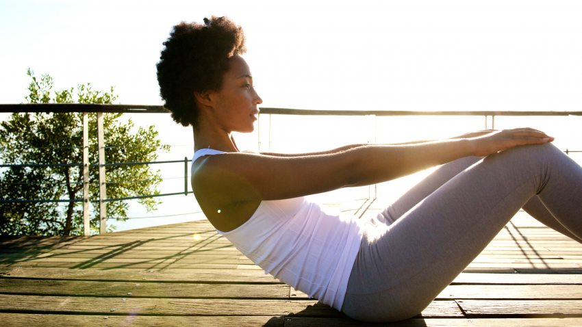 female_yoga_student_practicing_boat_pose