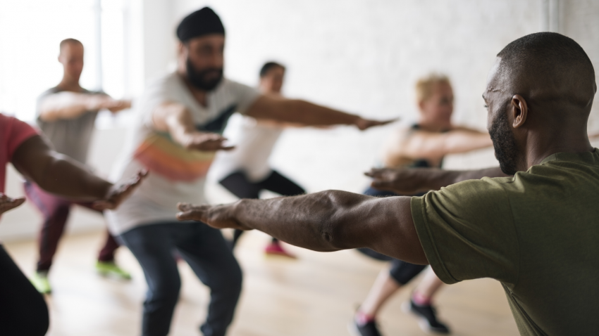 Yoga class practicing for neck pain