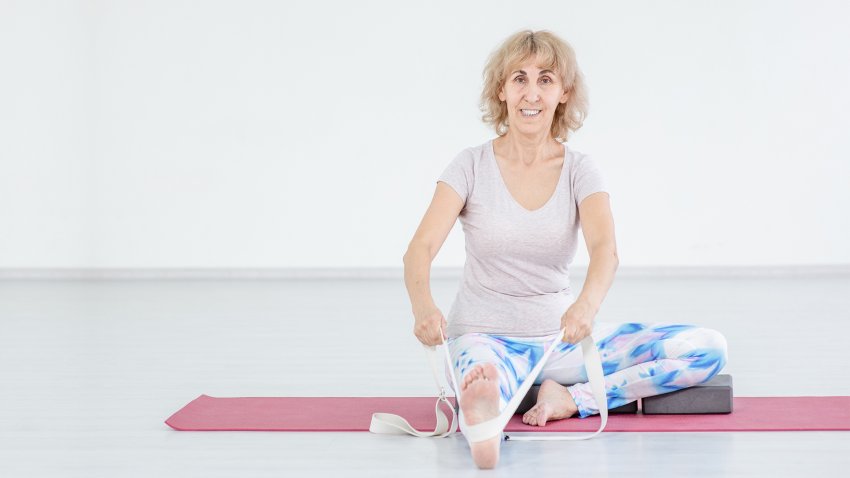 Woman yoga for back pain Head to Knee Forward Bend (Janu Sirsasana) Woman yoga for back pain Head to Knee Forward Bend (Janu Sirsasana)