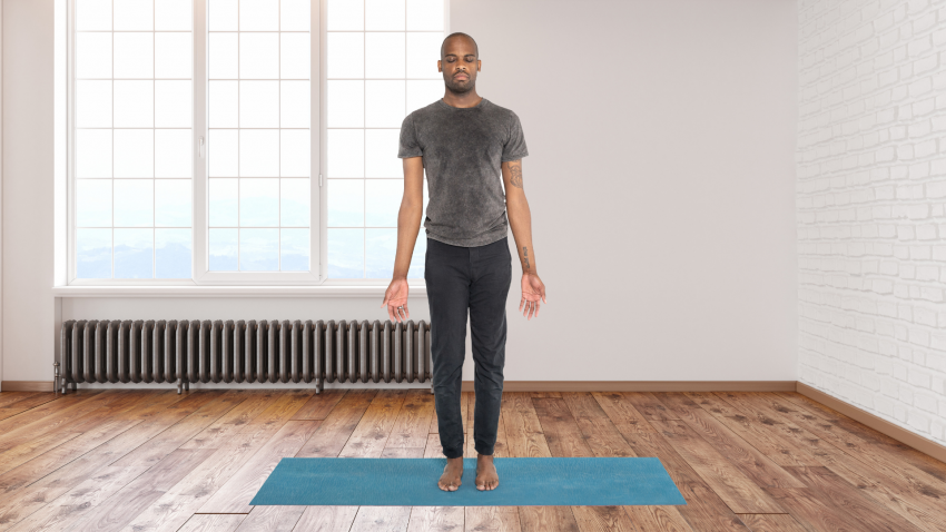 Man practicing yoga for feet in Mountain Pose (Tadasana)