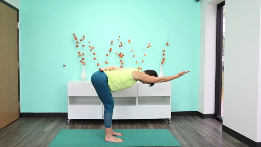 Yoga to relax upper back and neck standing pose