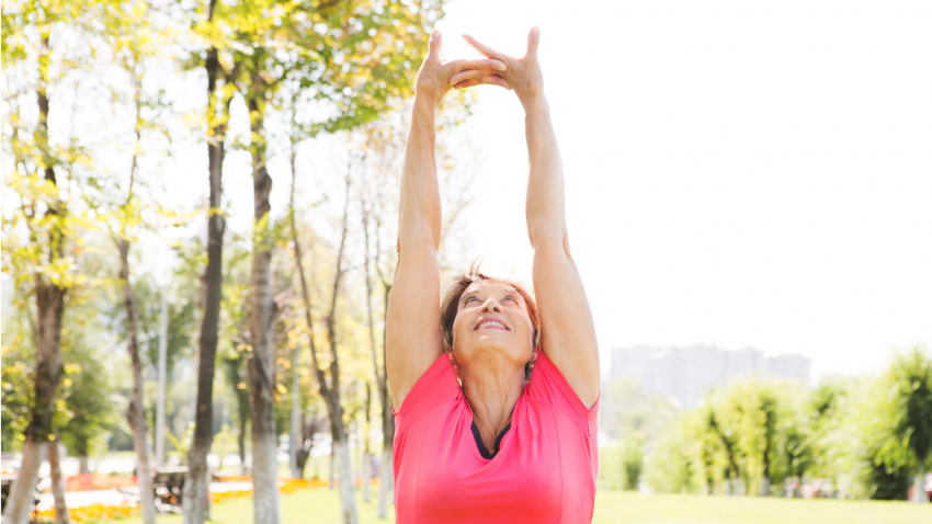 Older woman practicing yoga for arthritis relief