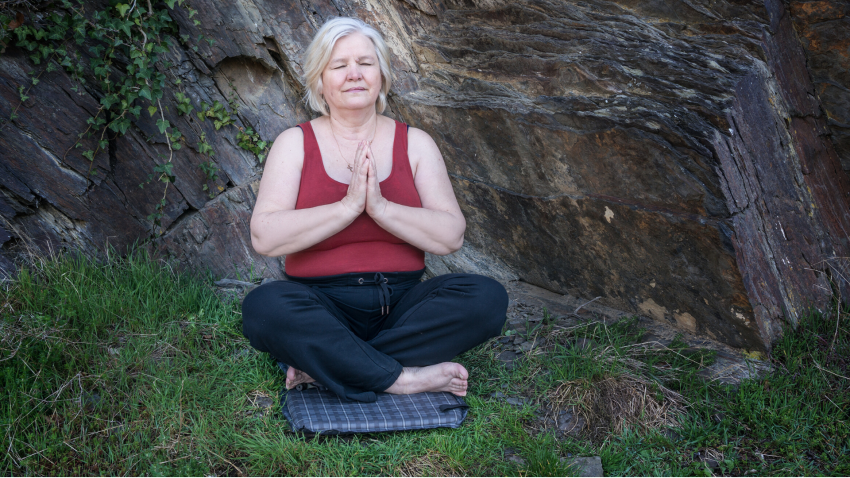 Woman practicing yoga in seated pose the 5 koshas Woman practicing yoga in seated pose the 5 koshas