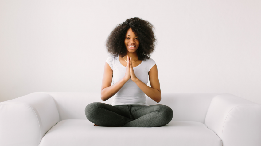 Woman practicing yoga to awaken wisdom in seated pose Woman practicing yoga to awaken wisdom in seated pose