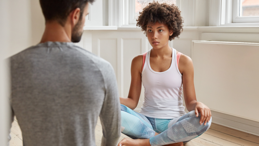 Yoga student and teacher working with chronic pain