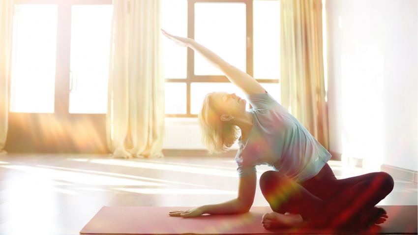 woman practicing yoga for cancer to help alleviate lymphedema