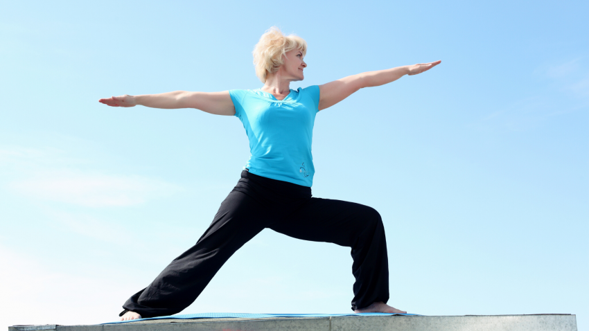 Yoga woman for heart health in Warrior II Pose (Virabhadrasana II) Yoga woman for heart health in Warrior II Pose (Virabhadrasana II)