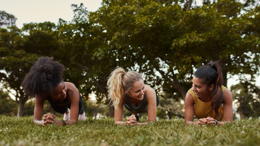 Teens practicing yoga for anxiety in Plank Pose (Phalakasana)