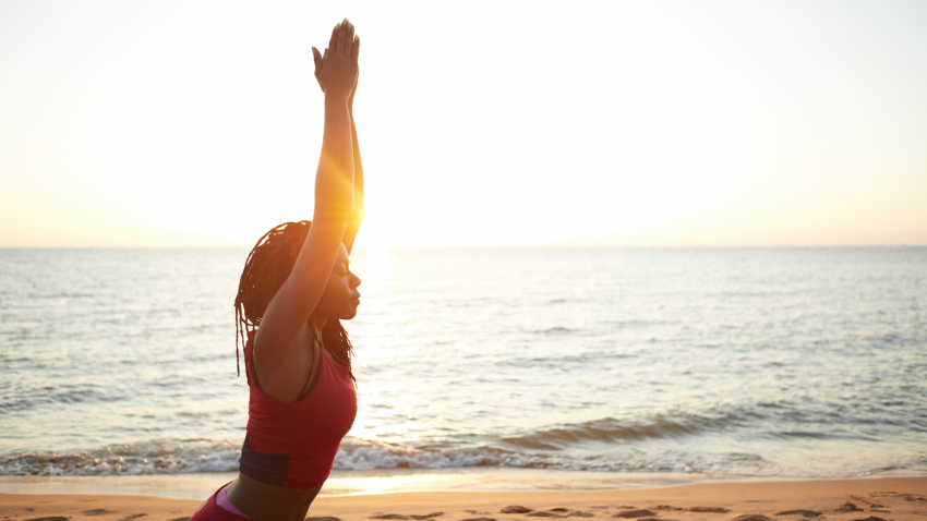Woman practicing yoga for back pain SI joint health Woman practicing yoga for back pain SI joint health