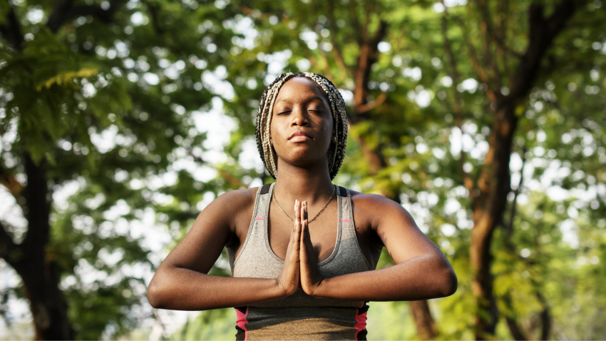 Woman practicing yoga for low back pain
