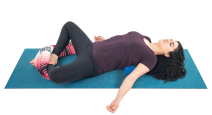 Supta Baddha Konasana a restorative pose with props.