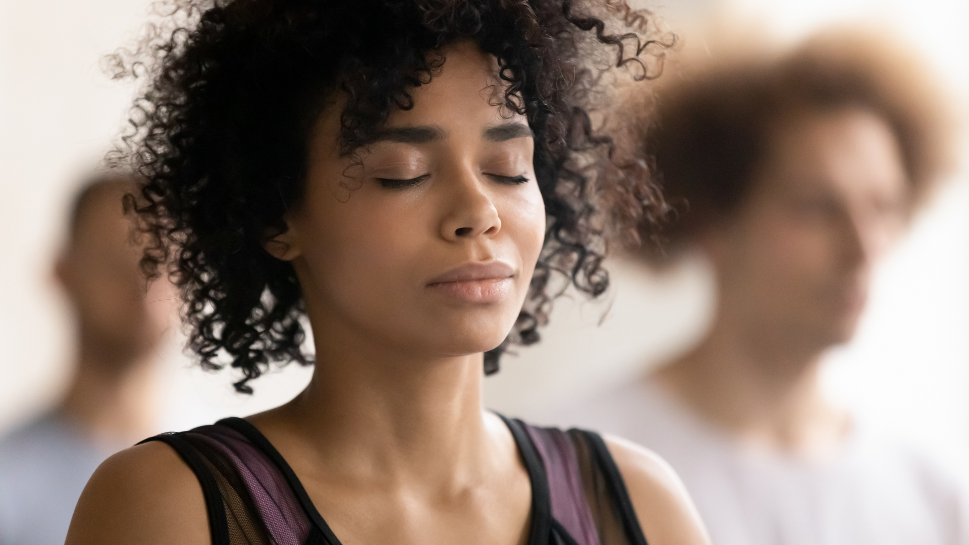 Young woman depicted in quiet, inward reflection