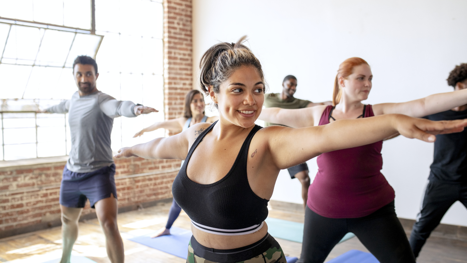 The benefits of practicing yoga in Warrior II pose in order to practice self care